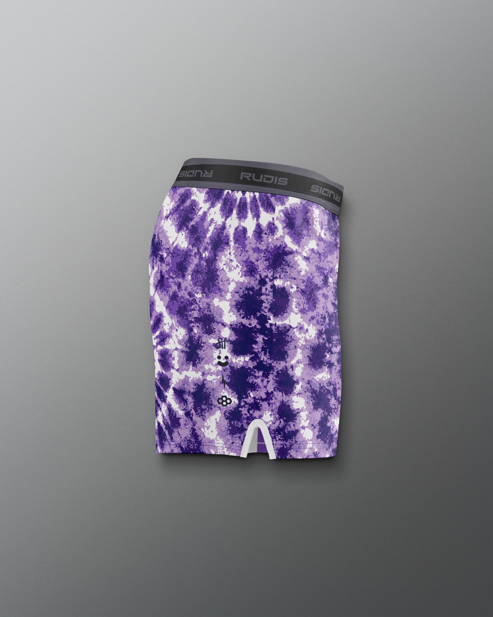 Purple tie-dye shorts with a brand logo on a gray background