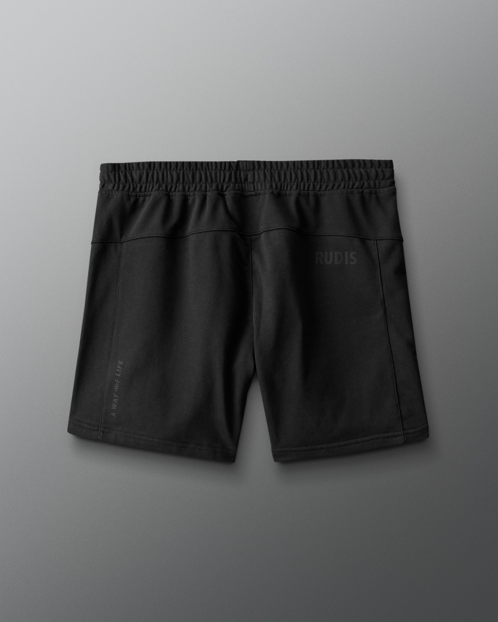 Black shorts with a brand logo on a gray background