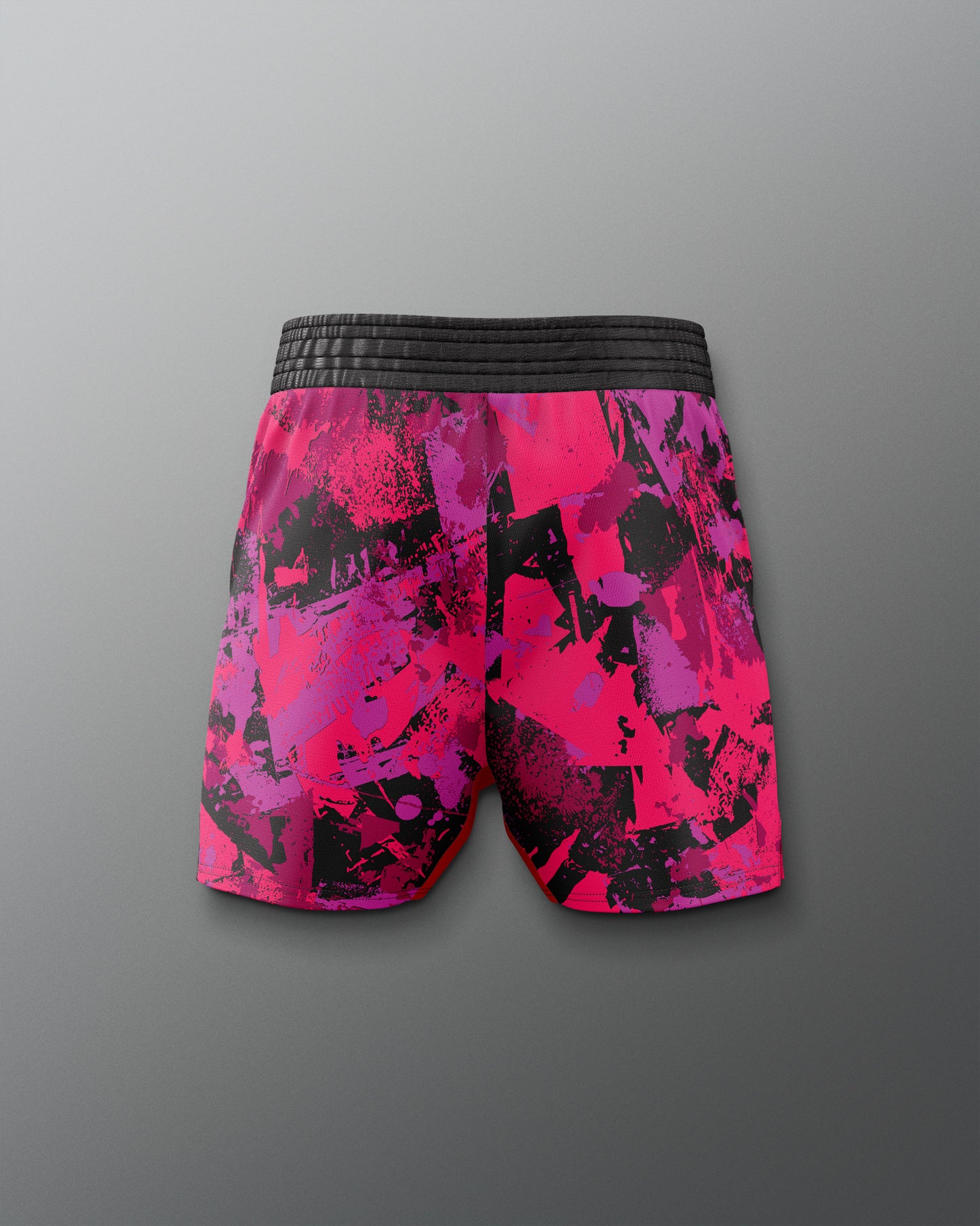Pink and black patterned shorts on a gray background