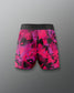 Pink and black patterned shorts on a gray background