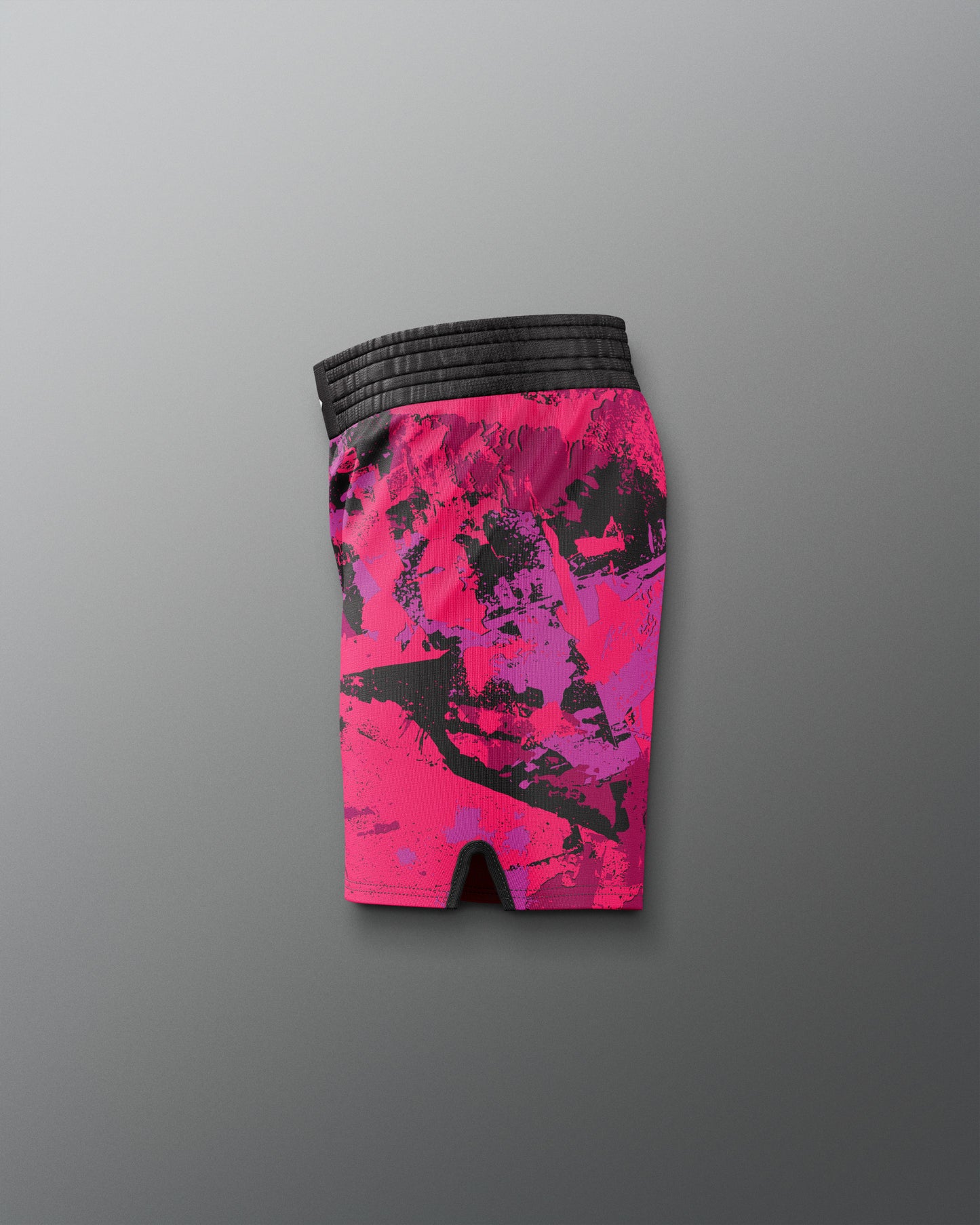 Pink and black patterned shorts on a gray background