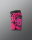 Pink and black patterned shorts on a gray background