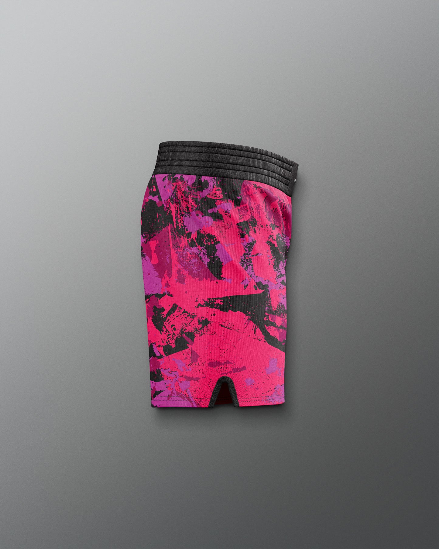 Pink and black patterned shorts on a gray background