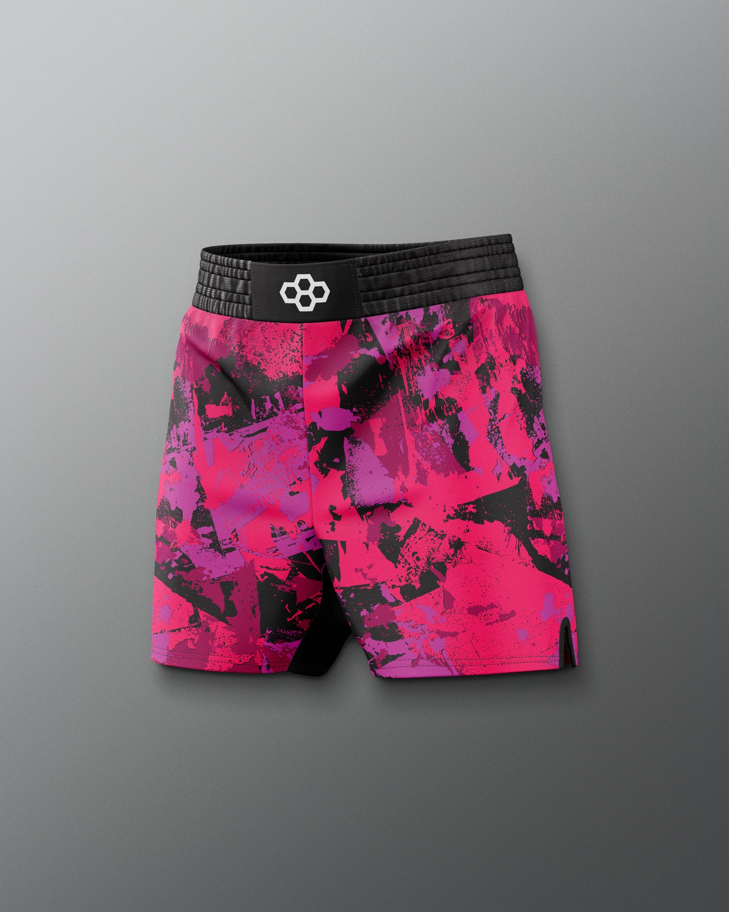 Pink and black patterned shorts with a brand logo on a gray background