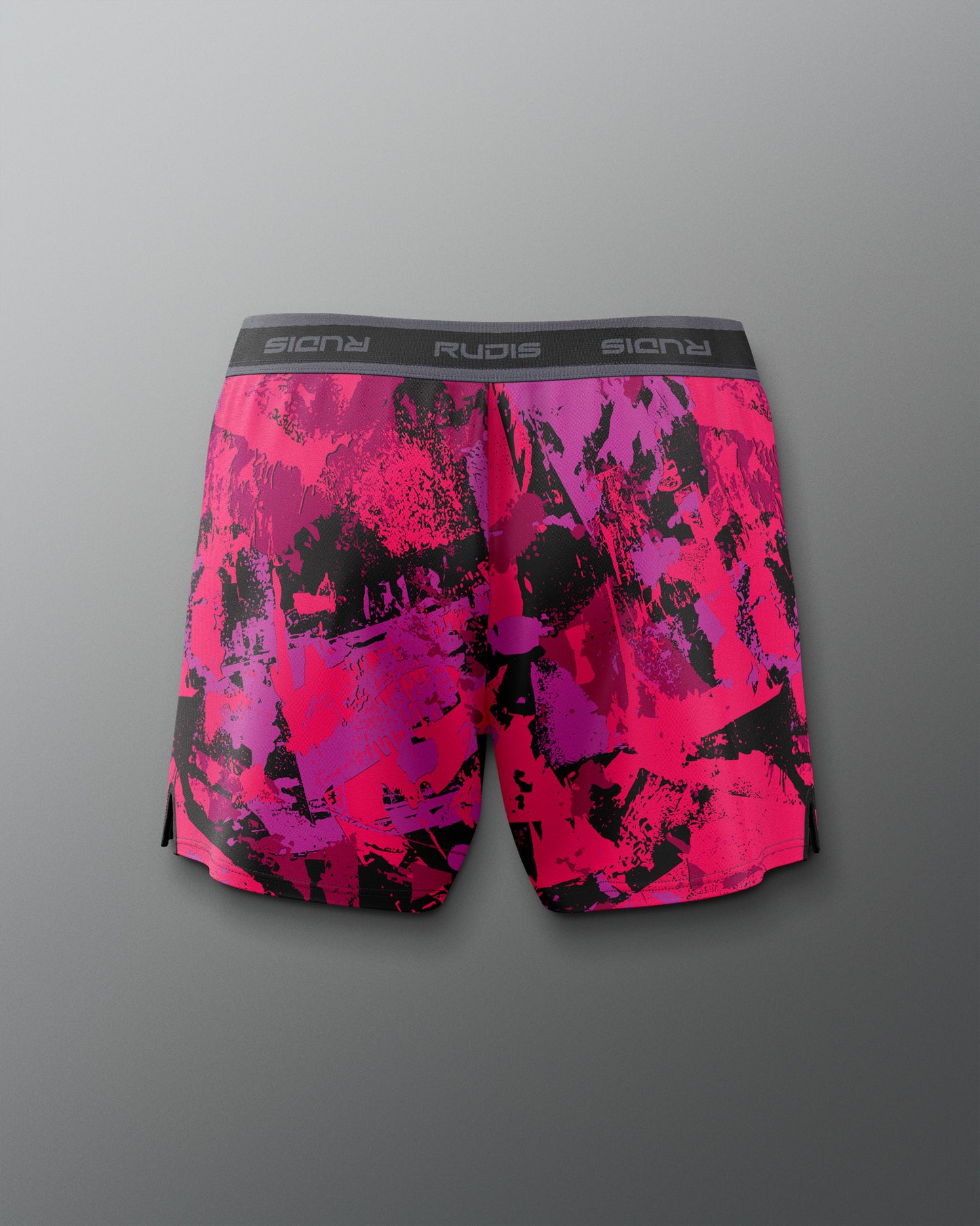 Pink and black patterned shorts with 'Rudis' branding on a gray background