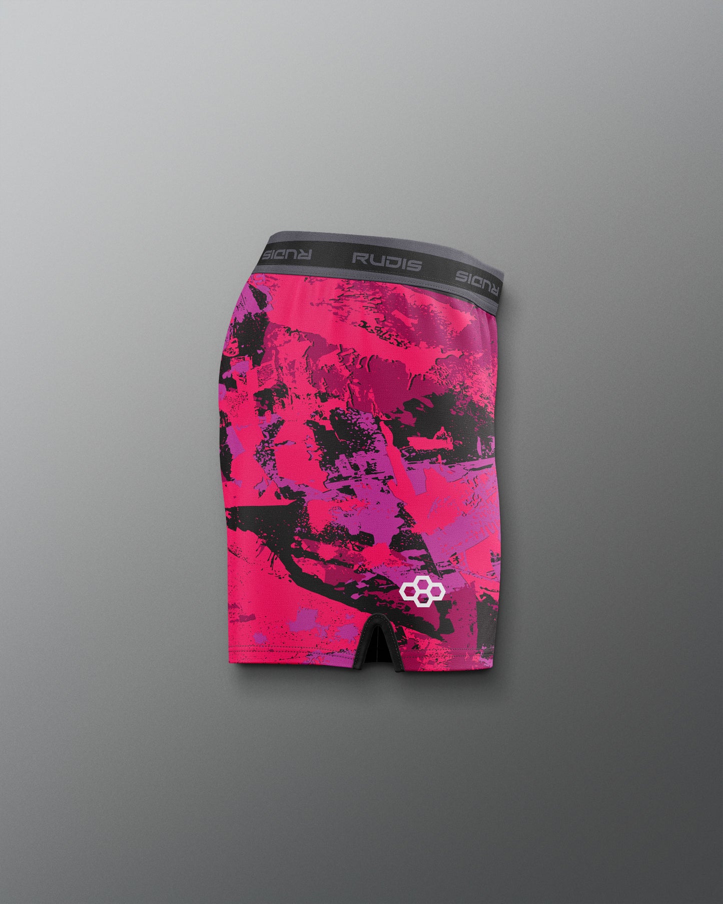 Pink and black patterned underwear with visible branding on a gray background