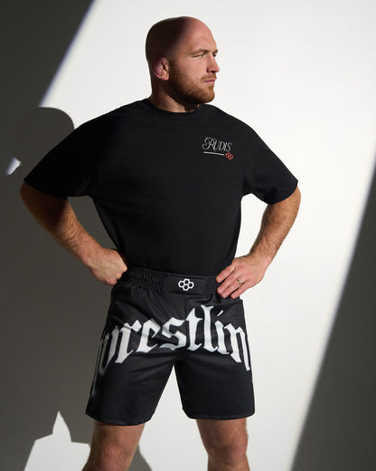 RUDIS Gothic Wrestling Sublimated Shorts in black with bold gothic "Wrestling" graphics, lightweight moisture-wicking fabric, and an athletic fit designed for wrestling training and everyday performance.