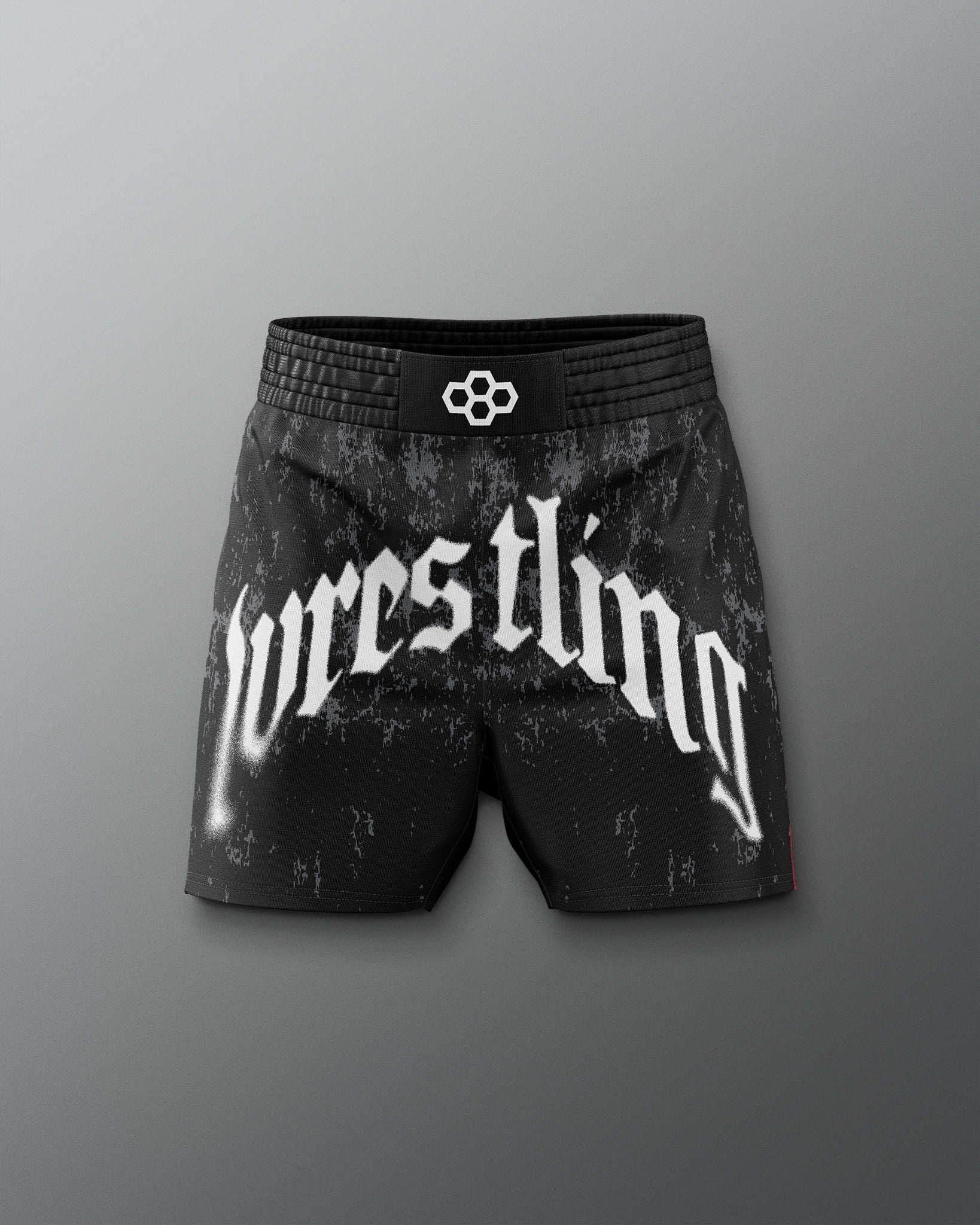 Black wrestling shorts with 'wrestling' text on a gray background