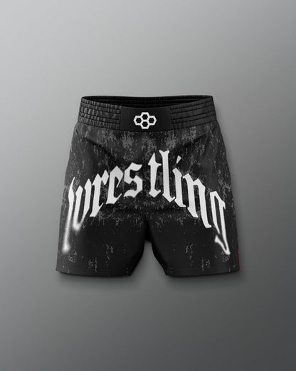 Black wrestling shorts with 'wrestling' text on a gray background