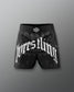 Black wrestling shorts with 'wrestling' text on a gray background