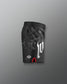 Black athletic shorts with white logo and red accents on a gray background