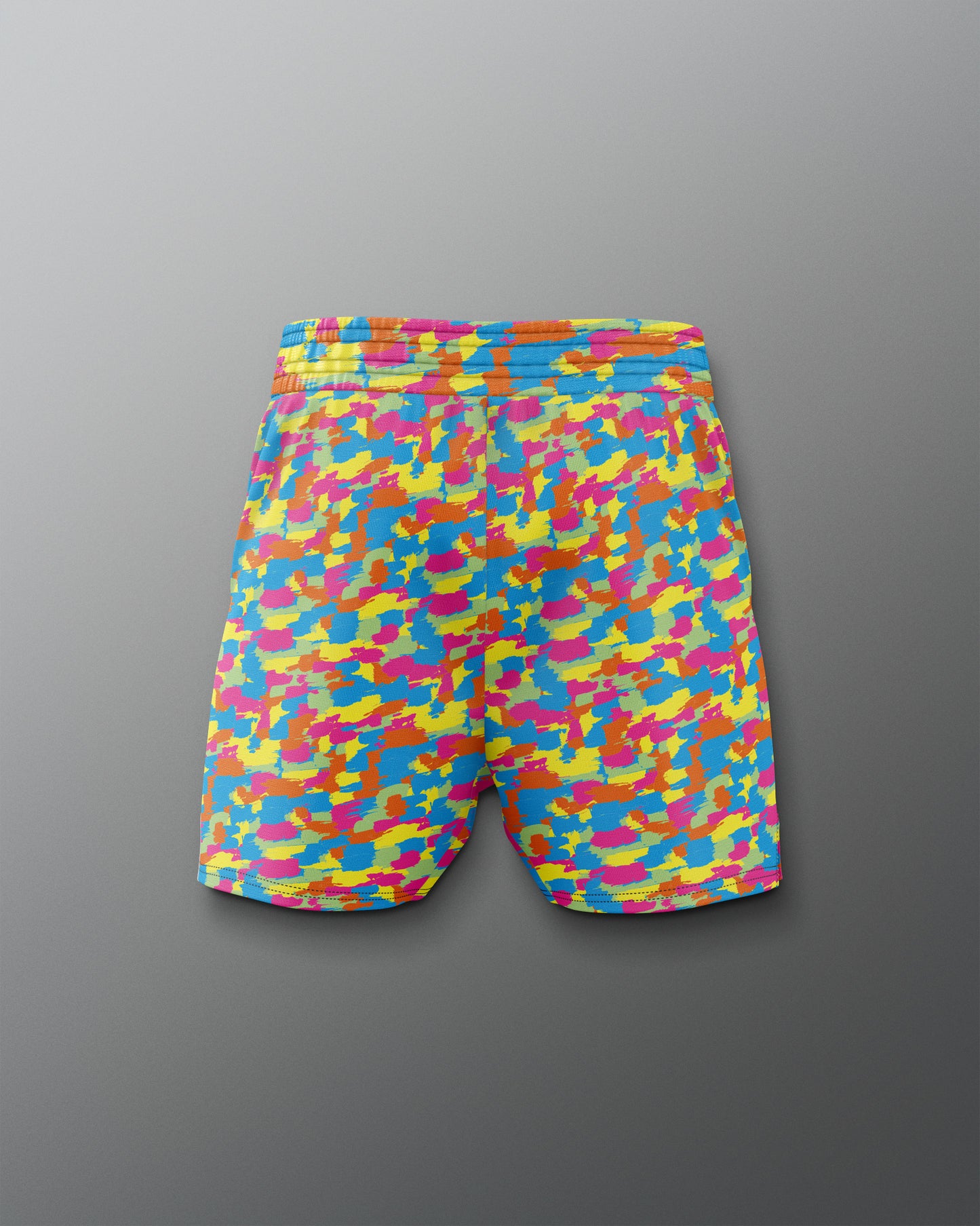 Colorful camouflage-patterned shorts on a gray background