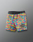 Colorful camouflage wrestling shorts with 'Rudis' branding on a gray background