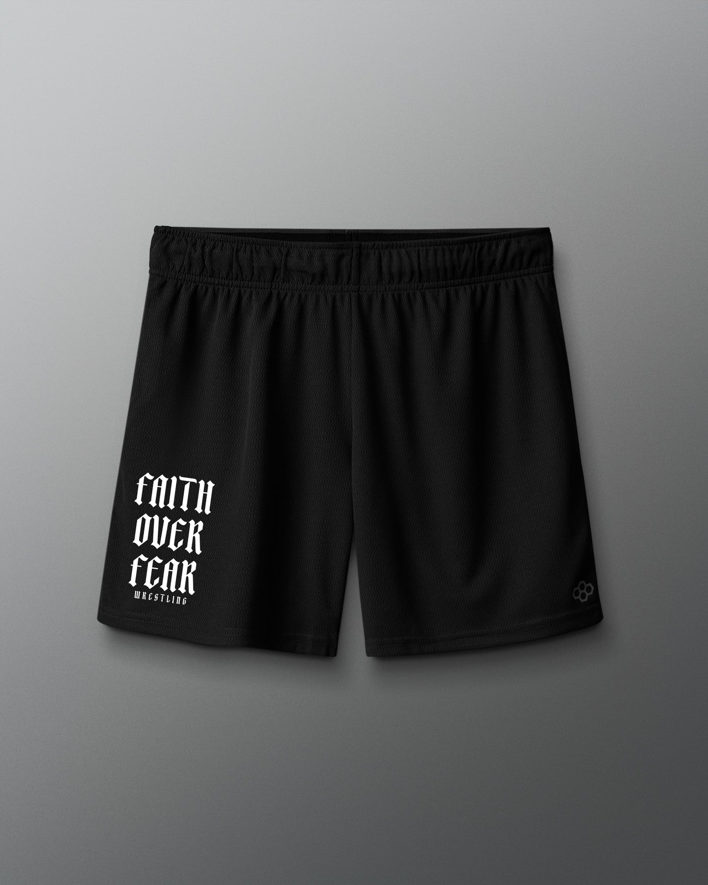Black shorts with 'Faith Over Fear' text on a gray background