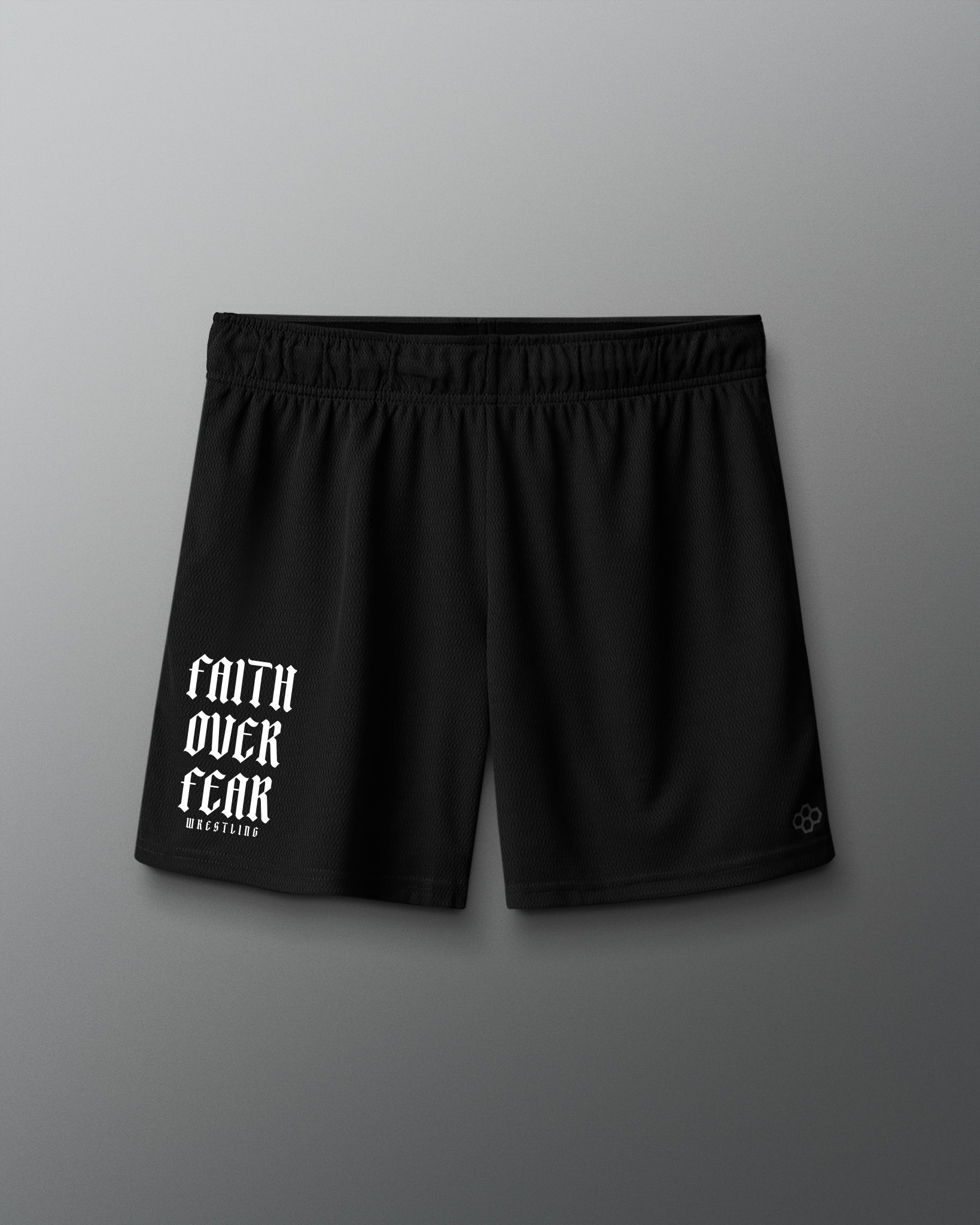 Black shorts with 'Faith Over Fear' text on a gray background