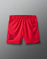 Red shorts with 'fear has no power' text on a gray background