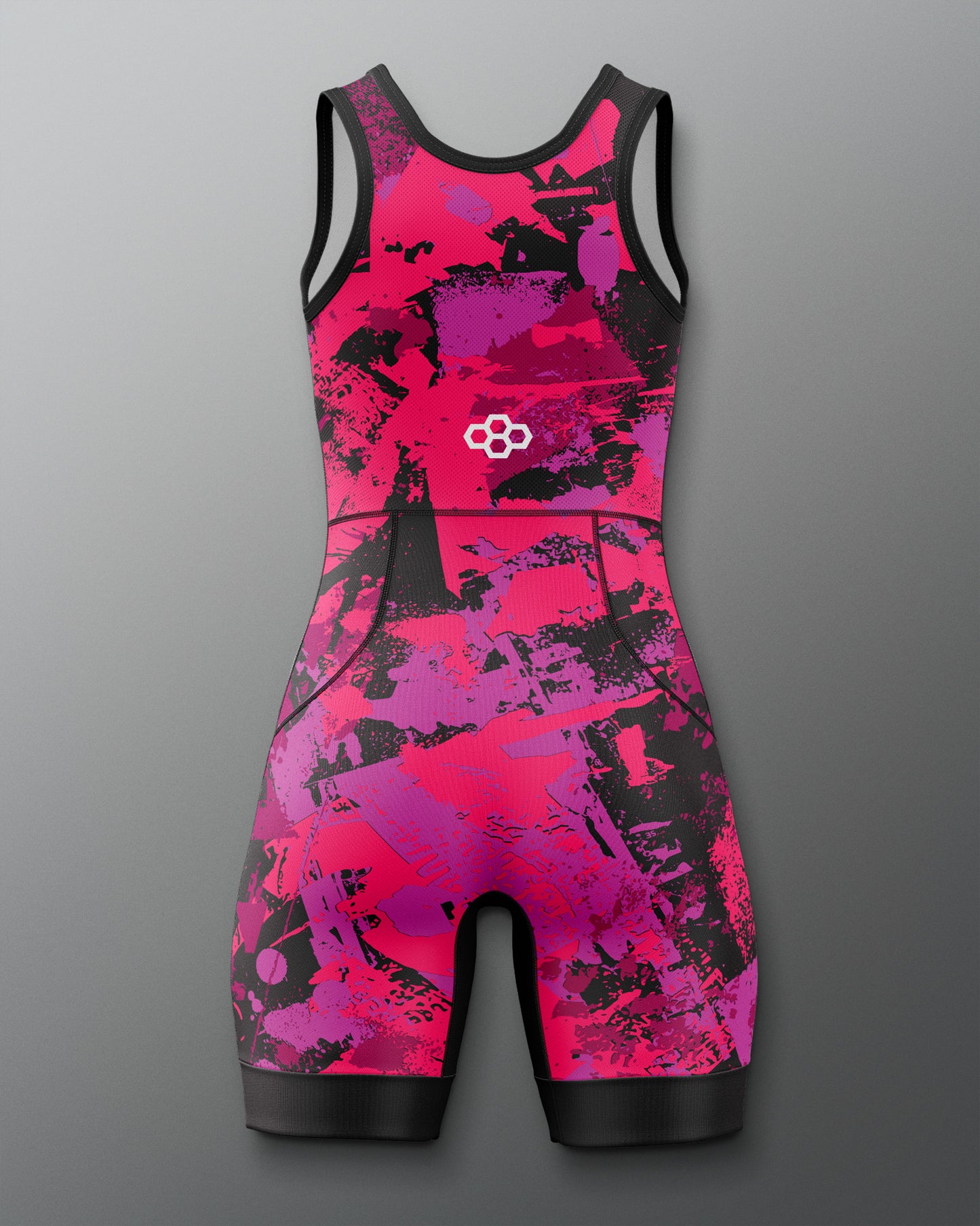 Pink and black patterned swimsuit on a gray background
