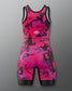 Pink and black patterned swimsuit on a gray background