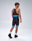 A man wearing a black athletic Wrestling singlet with bright blue accents, shown from the back in a studio setting.