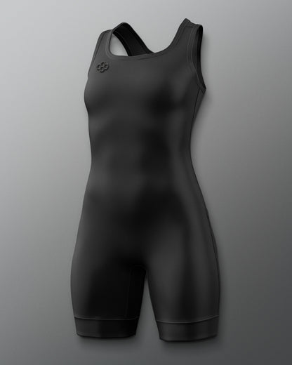A black athletic one-piece wrestling singlet with a racerback design and a small circular logo on the left chest, displayed against a neutral gray background.