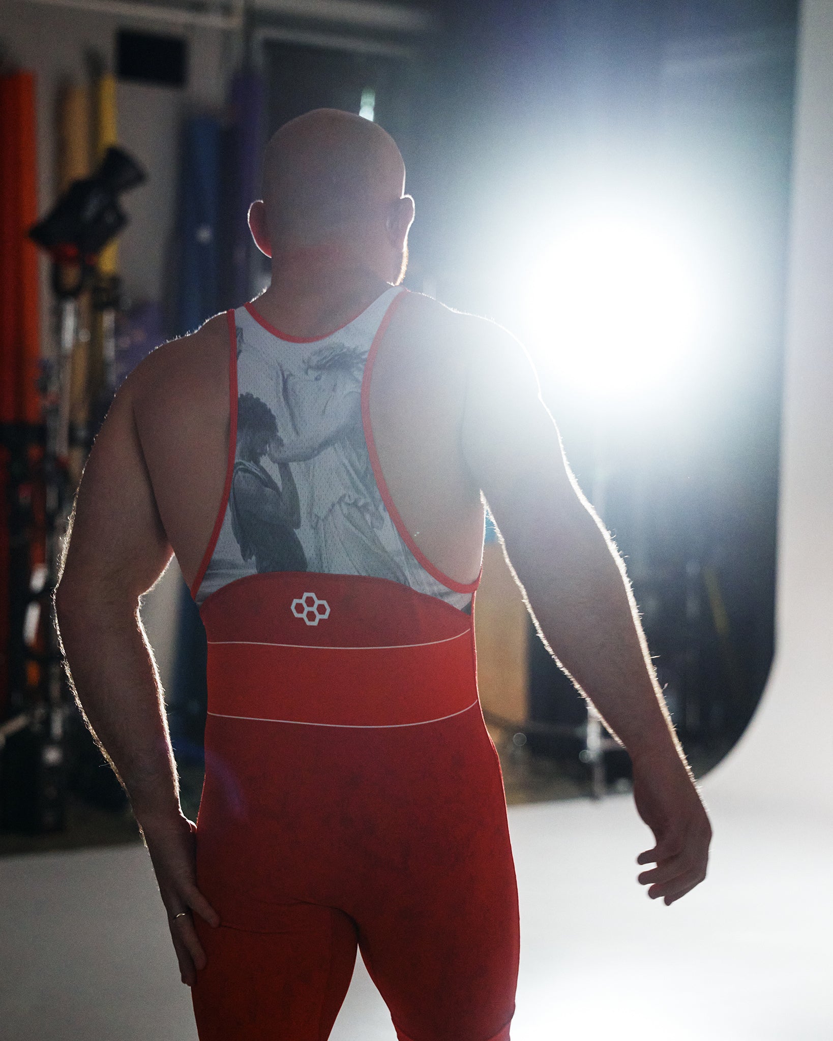 Rear view of the RUDIS Faith Over Fear Freestyle Elite 2.0 Wrestling Singlet in red, featuring a breathable racerback design, artistic sublimated back panel, and streamlined competition fit.