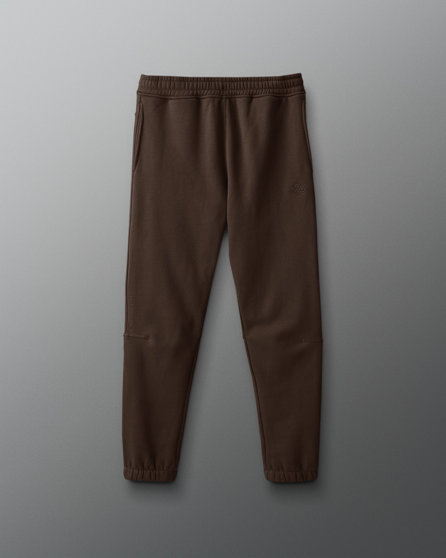 Brown sweatpants on a gray background