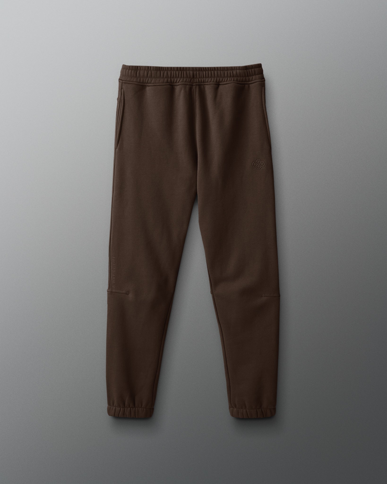 Brown sweatpants on a gray background