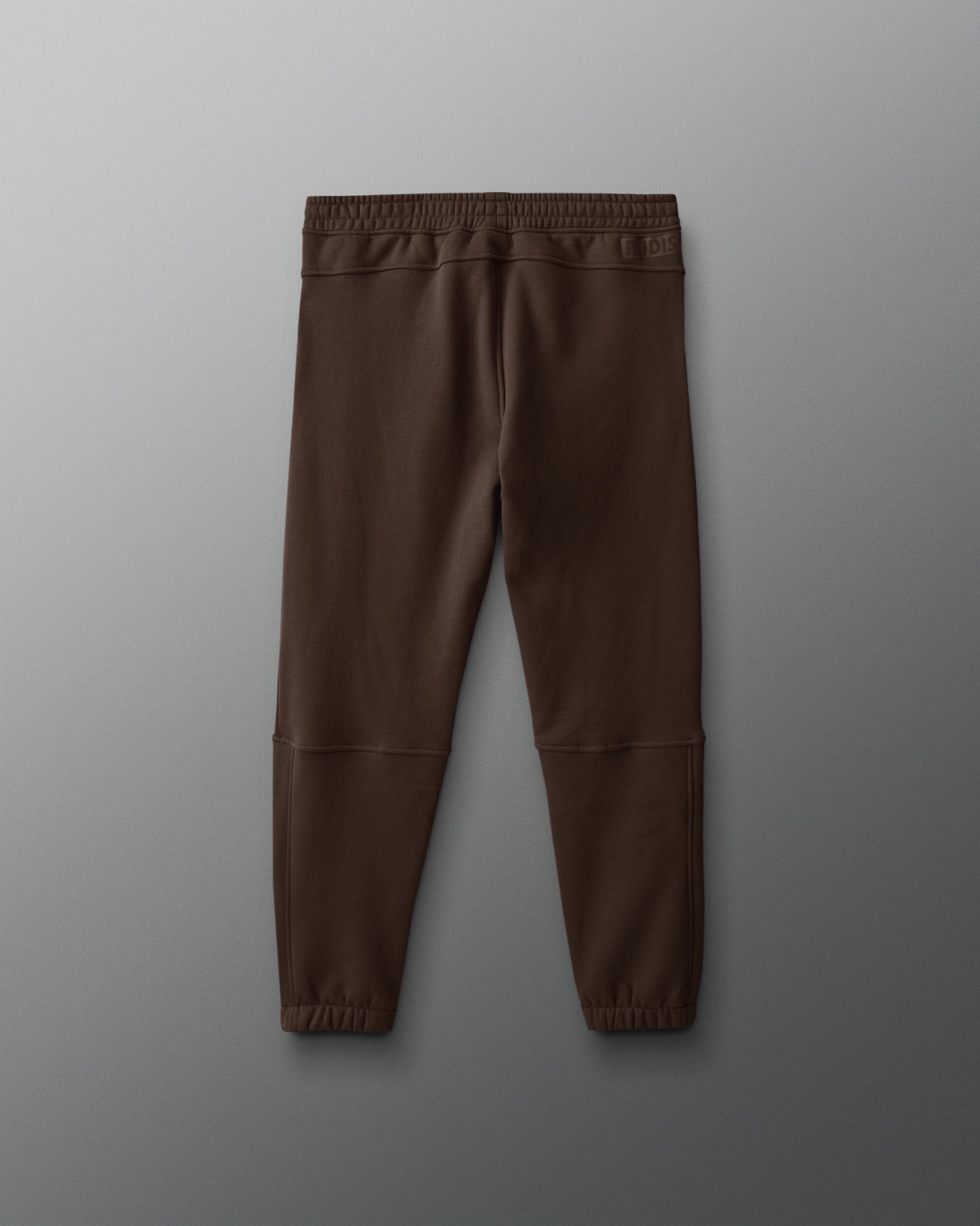 Brown pants on a gray background