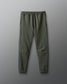 Green sweatpants on a gray background