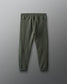 Green jogger pants on a gray background