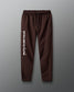 Brown sweatpants with 'Fath over Fear' text on a gray background