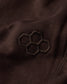 Close-up of a brown fabric with an embroidered Quadhex pattern.