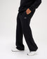 Side view of RUDIS Comfort Fleece Wide Leg Sweatpants in Black, featuring a relaxed wide-leg silhouette, side pockets, drawstring waistband and RUDIS logo.
