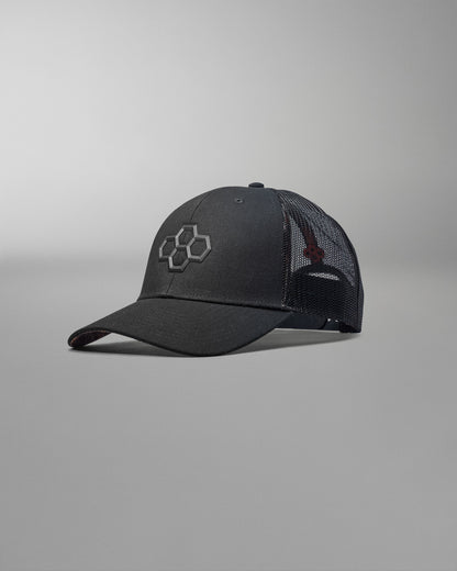 Black baseball cap with a logo on a gray background