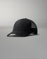 Black cap with mesh back on a gray background