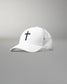 Front angled view of the RUDIS Fearless Faith Bridge Trucker Hat in White, featuring an embroidered black cross, curved brim and breathable white mesh panels.