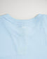 A light blue T-shirt featuring a simple modern design with a subtle white graphic at the neckline