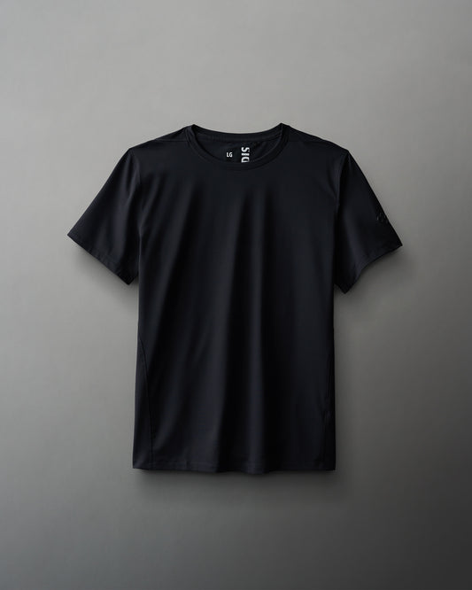 A black textured waffle material t-shirt displayed against a neutral background.