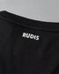 Close-up of a black garment with 'RUDIS' branding on a gray background