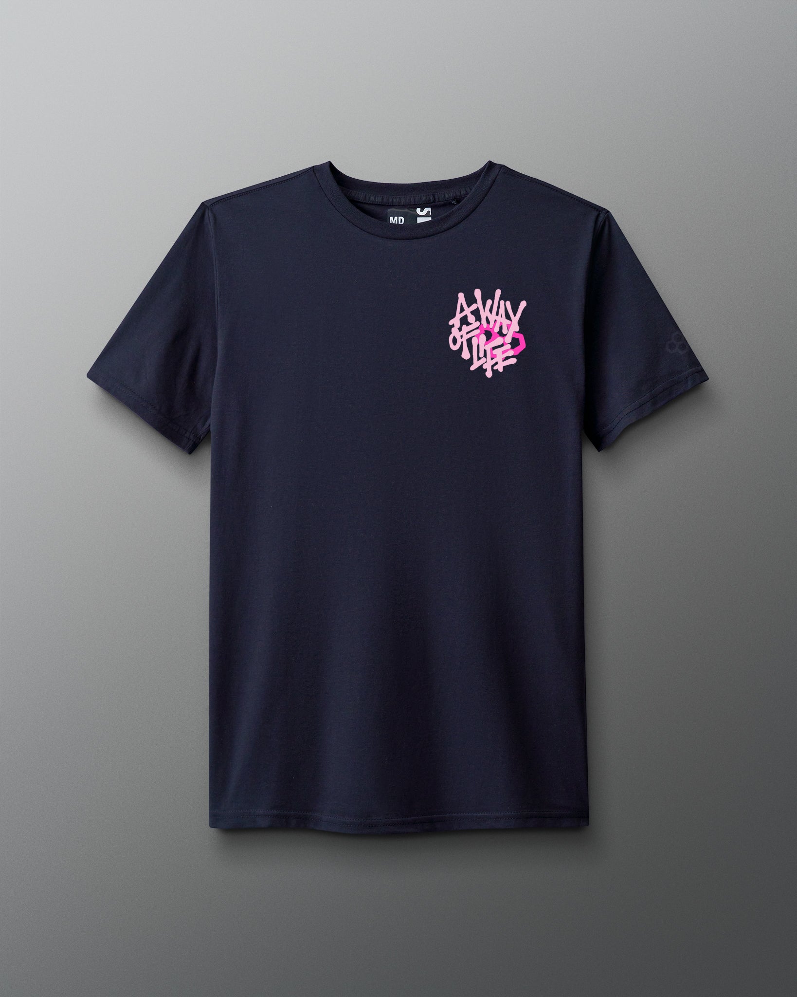 Front view of a navy T-shirt with a small white and pink graphic on the left chest that reads ‘A Way of Life’ in stylized overlapping text. 