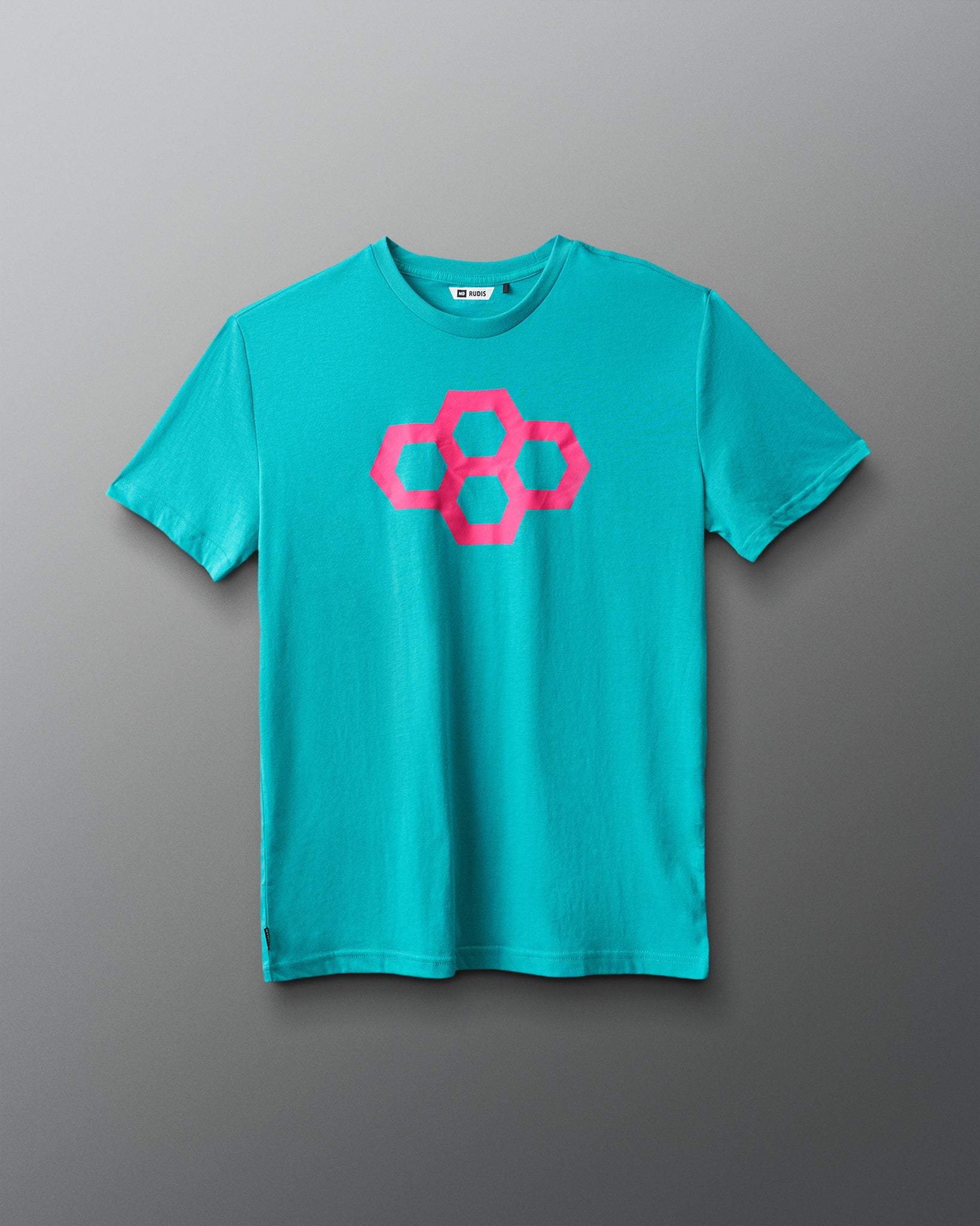 Turquoise t-shirt with pink quadhex design on a gray background
