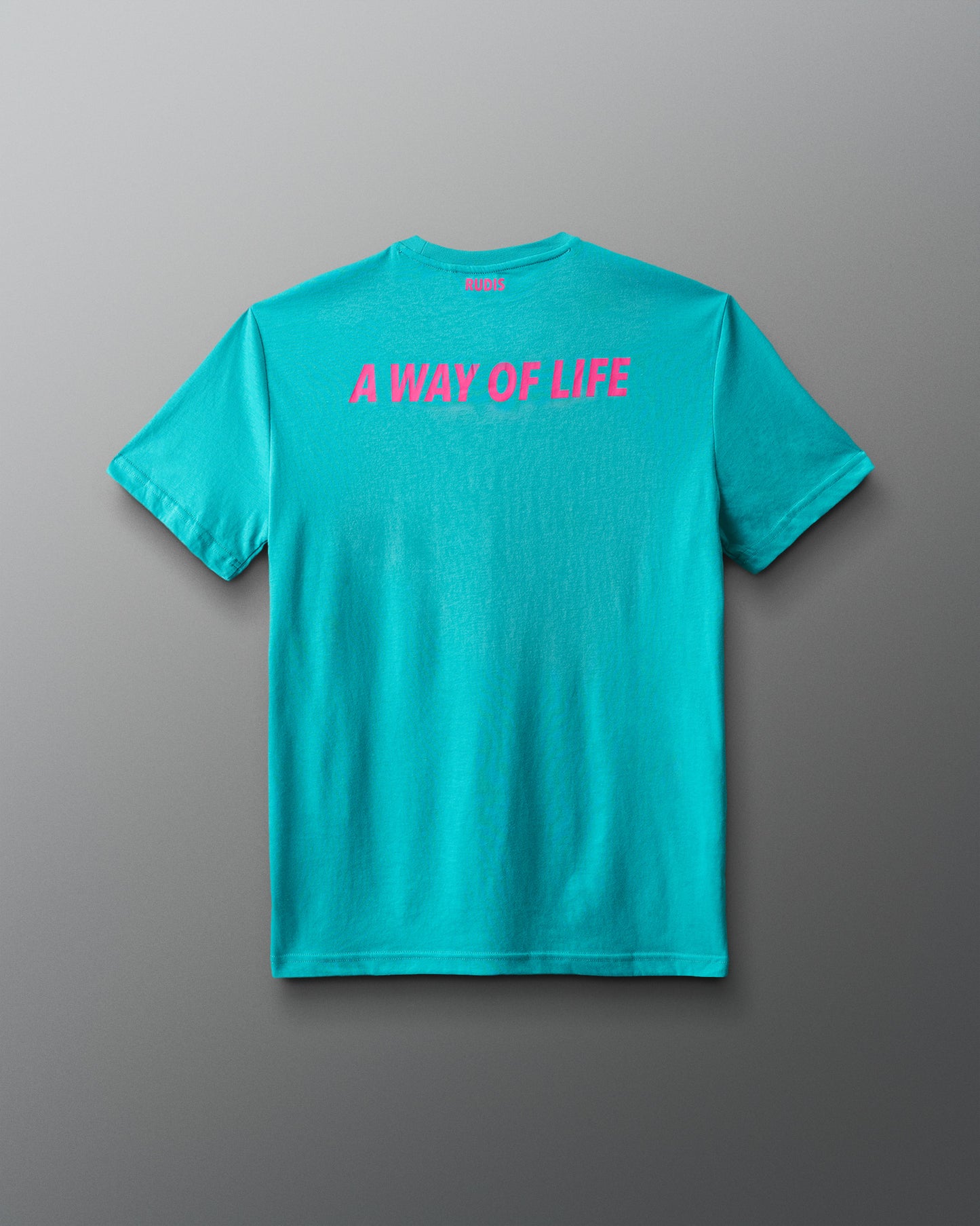 Turquoise t-shirt with pink text 'A WAY OF LIFE' on a gray background