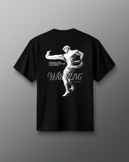 A black heavyweight cotton T-shirt with a graphic print of a wrestler and the word 'WRESTLING' on the front.
