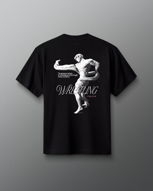 A black heavyweight cotton T-shirt with a graphic print of a wrestler and the word 'WRESTLING' on the front.