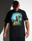 Man wearing a black t-shirt with a graphic design on a plain background