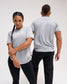 Male and female athletes wearing the gray RUDIS Motto Scripted Elite Super Soft T-Shirt with All In and A Way of Life graphics.