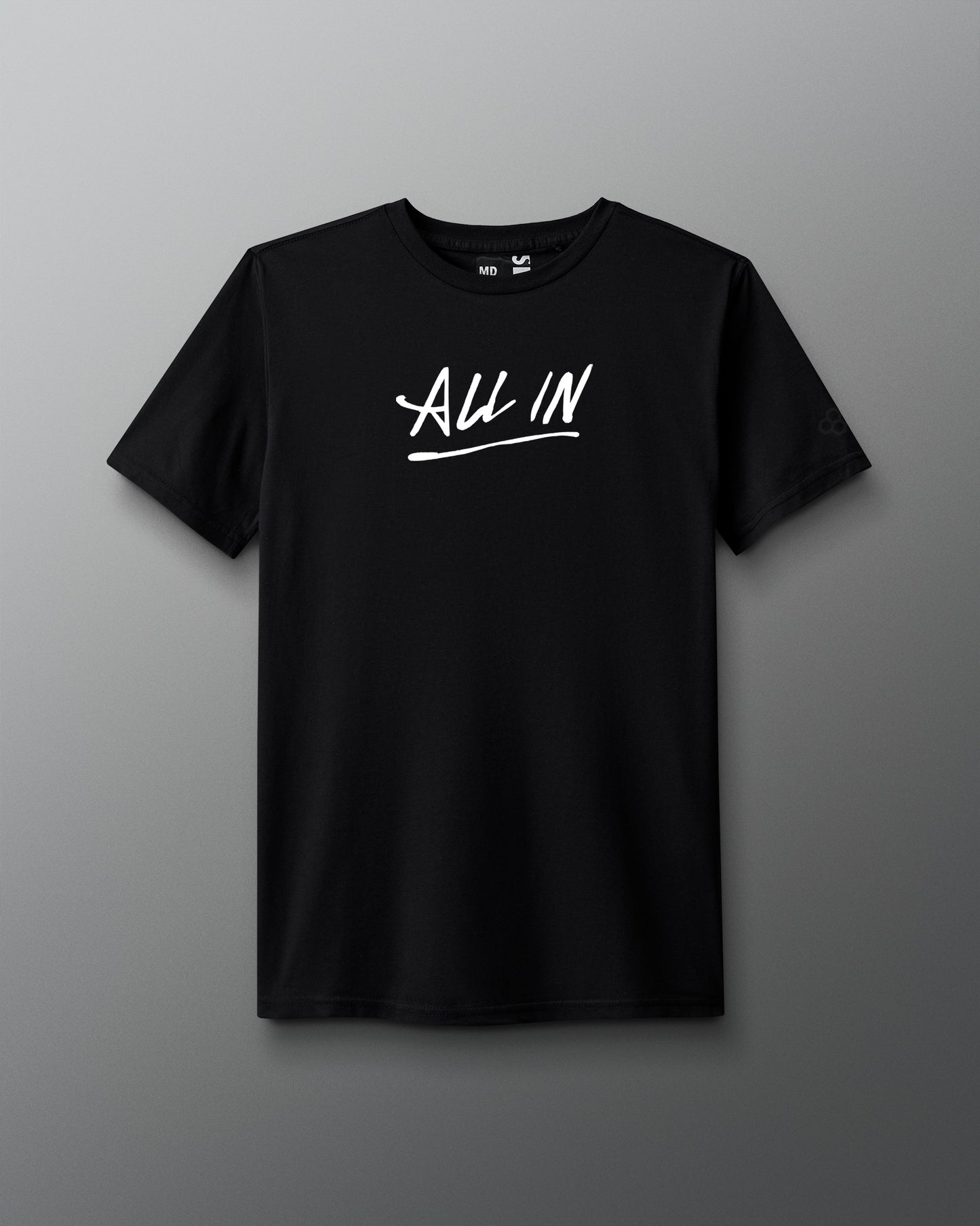 Front view of a black T-shirt with the phrase ‘ALL IN’ printed in bold white handwritten-style lettering across the chest, with an underline.