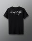 Back view of a black T-shirt with the phrase ‘A Way of Life’ printed in large white handwritten-style script across the upper back.