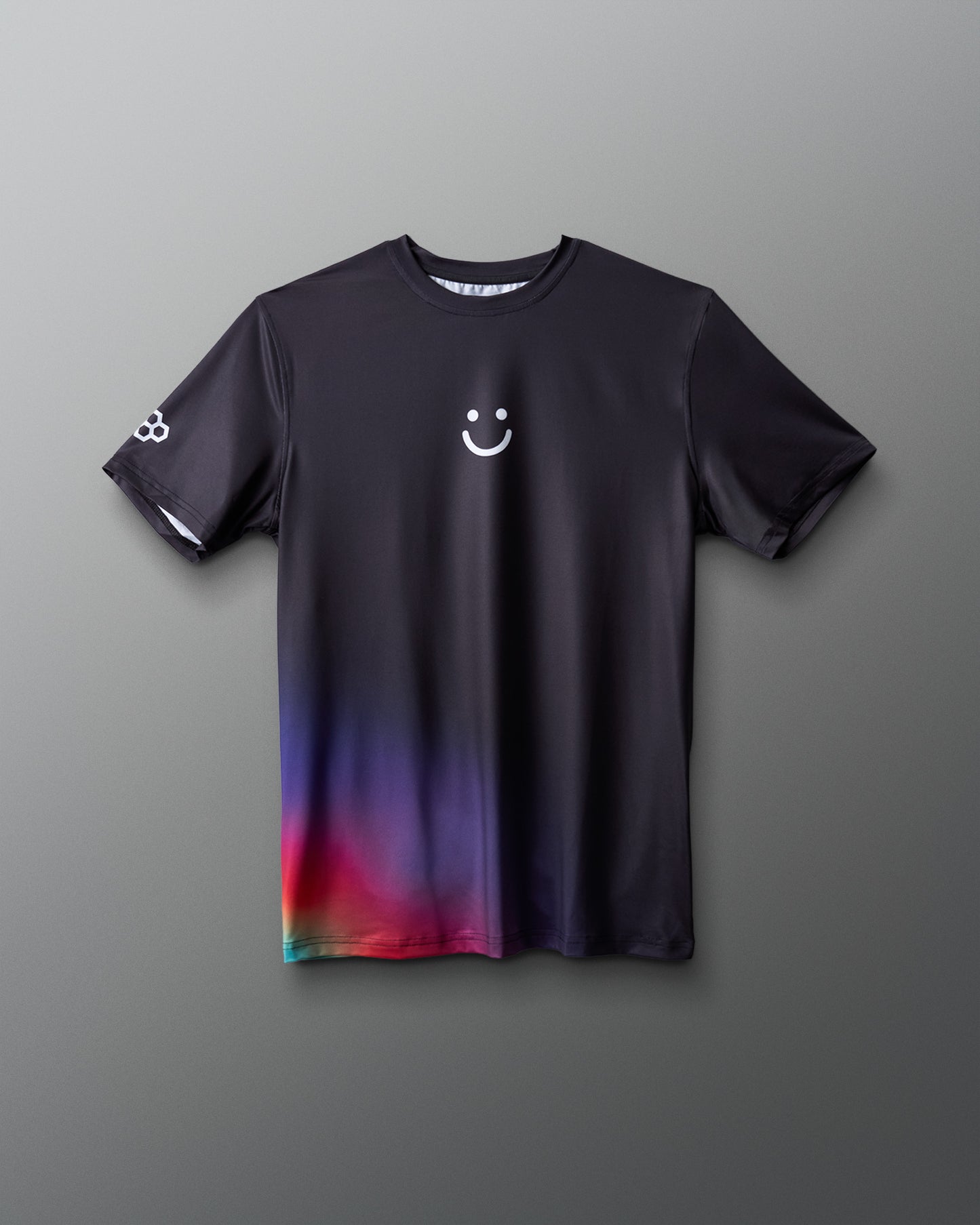 Black t-shirt with a smiley face design on a gray background