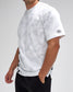 Person wearing a white t-shirt with black logo on a plain background